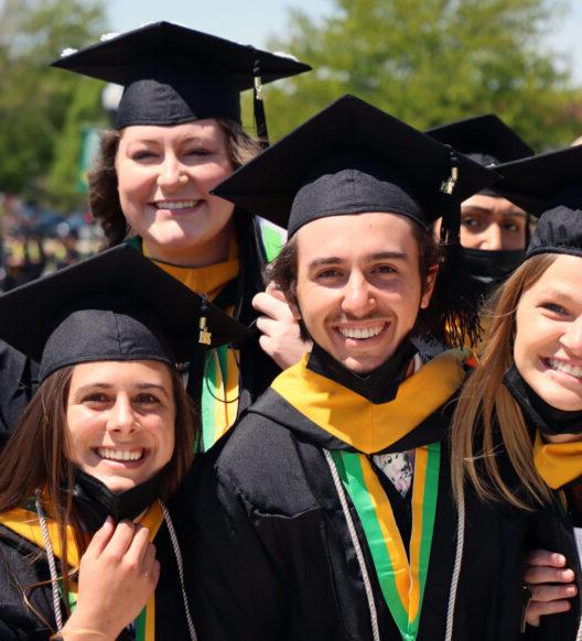 group of graduates in caps and gowns